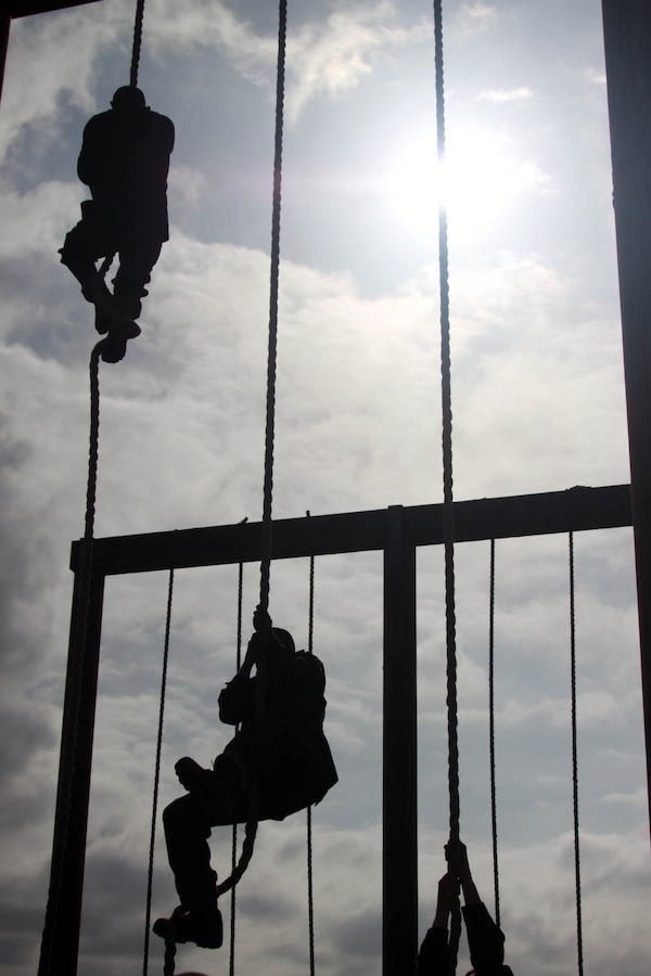 Company A recruits climb ropes at the end of the Obstacle Course May 3 aboard Marine Corps Recruit Depot San Diego. This is the last obstacle on the course that recruits have to overcome. This course requires recruits to use a lot of upper body strength, making it even more challenging to climb the rope at the end of the course.