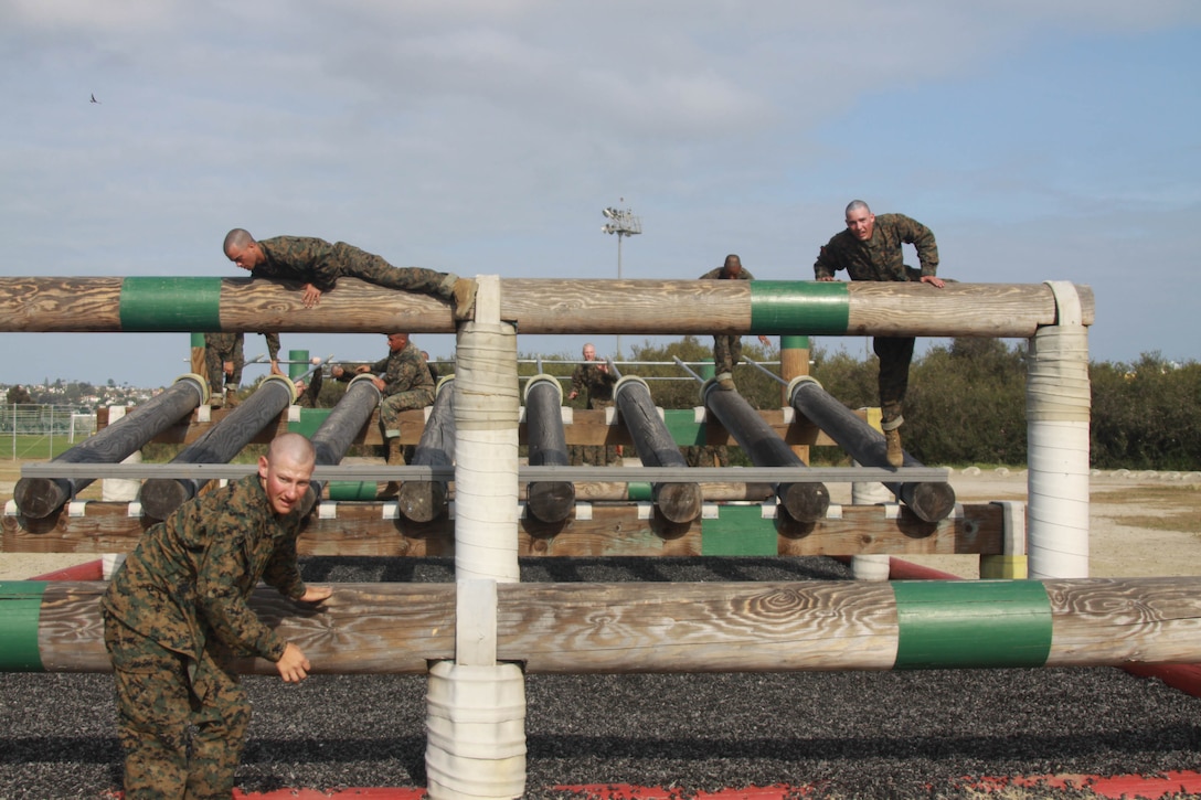 Company A recruits overcome the Obstacle Course May 3 aboard Marine Corps Depot San Diego. There were various obstacles the recruits had to complete to finish the course. Much of the course required recruits to use their upper body strength.