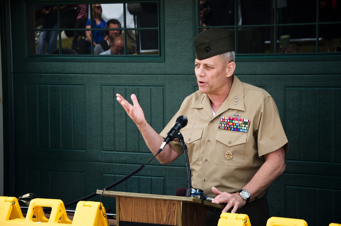 Lieutenant Gen. John M. Paxton Jr., commanding general of II Marine Expeditionary Force, speaks during the dedication ceremony of retired Marine Staff Sergeant Vincent Gizzarelli's brand new house, Jacksonville, N.C., Apr. 28. The house was built using supplies and donations from local businesses and various veterans' groups. Gizzarelli was medically retired from the Marine Corps after suffering traumatic brain injury and shrapnel wounds from multiple IED blasts that he sustained on his second tour to Iraq.