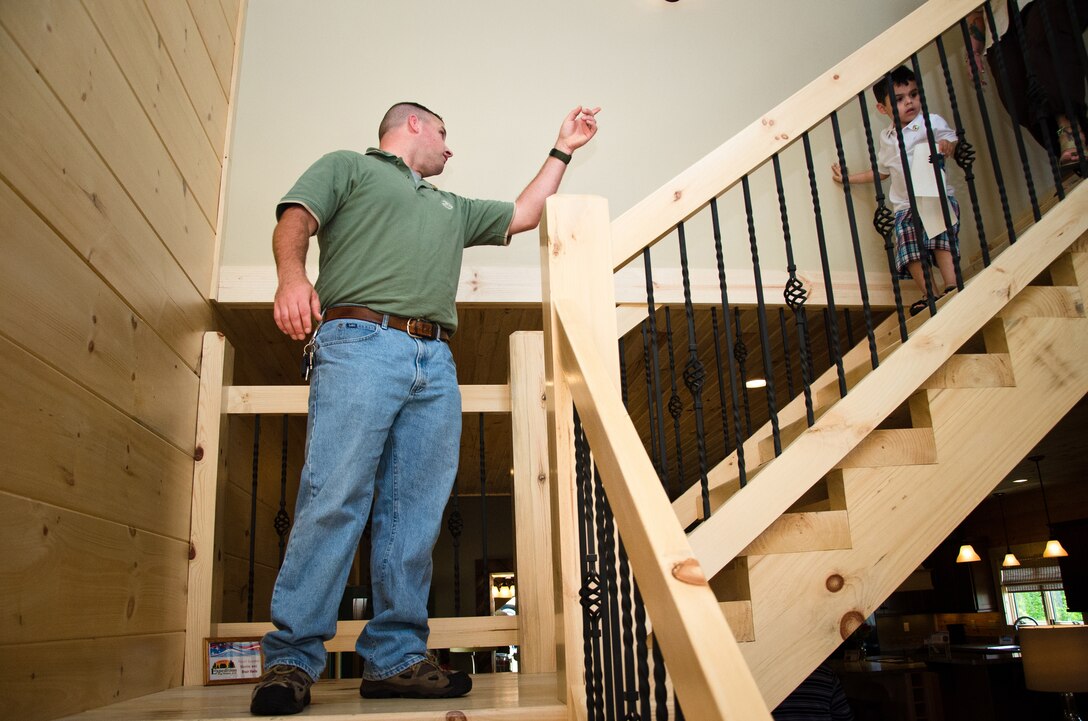 Retired Marine Staff Sergeant Vincent Gizzarelli tours his family's brand new house, Jacksonville, N.C., Apr. 28. The house was built using supplies and donations from local businesses and various veterans' groups. Gizzarelli was medically retired from the Marine Corps after suffering traumatic brain injury and shrapnel wounds from multiple IED blasts that he sustained on his second tour to Iraq.