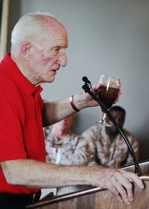 Retired Lt. Gen. Philip D. Shutler raises his glass to the Marine officers during a group discussion at Miller's Landing May 3, aboard Marine Corps Air Station Cherry Point, N.C. The Marines gathered around Shutler while he spoke about his time in the Marine Corps. He also spoke about the past, present and future of Marine Corps Aviation.