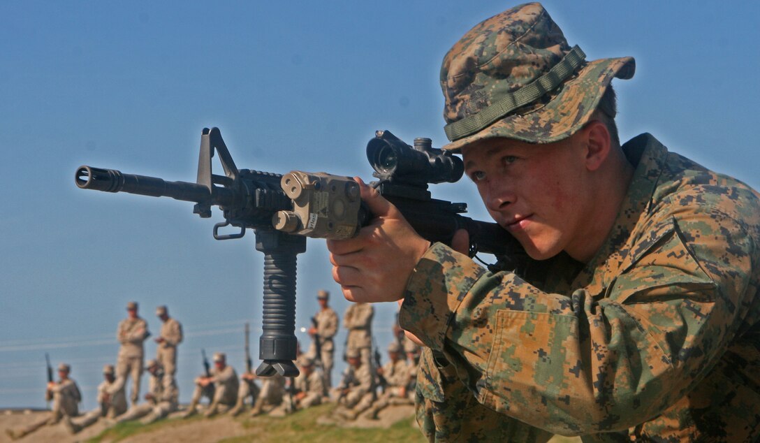 Black River Falls, Wis., native Cpl. David T. Gebhardt, a combat engineer with Company B, 2nd Combat Engineer Battalion, 2nd Marine Division, aims downrange during a practice run of the Combat Marksmanship Program May 5. The CMP was a small part of the battalion’s six-day training exercise May 1-6 and encompassed scenario-based combat simulations. (Official U.S. Marine Corps photo by Cpl. Andrew D. Johnston)