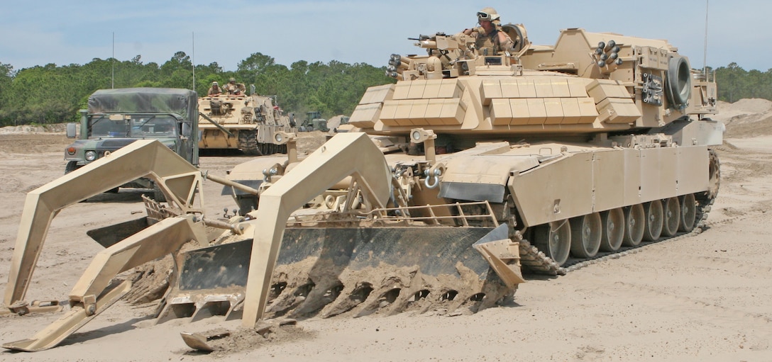 Assault breaching vehicle operators with 2nd Combat Engineer Battalion, 2nd Marine Division, stage their ABVs during a mechanized breach drill May 4.  The exercise was one event during the battalion’s six-day training operation May 1-6. (Official U.S. Marine Corps photo by Cpl. Andrew D. Johnston)