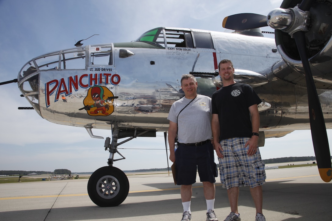 Paul Ringheiser Jr., left, and Paul Ringheiser III, stand on front of a B-25J Mitchell bomber owned by Disabled American Veterans flight team,  aboard Marine Corps Air Station Cherry Point, N.C., May 4, 2012. Paul III's grandfather Paul Ringheiser Sr. was a flight engineer on the Marine Corps equivalent of the aircraft during World War II era. "I was in the seat where he would have sat, right below the cockpit gunner," Paul Jr. said. "That’s where the flight engineer would have sat so it was really interesting and really emotional to think 'this is what he would have gone through,'" said Paul Sr.
