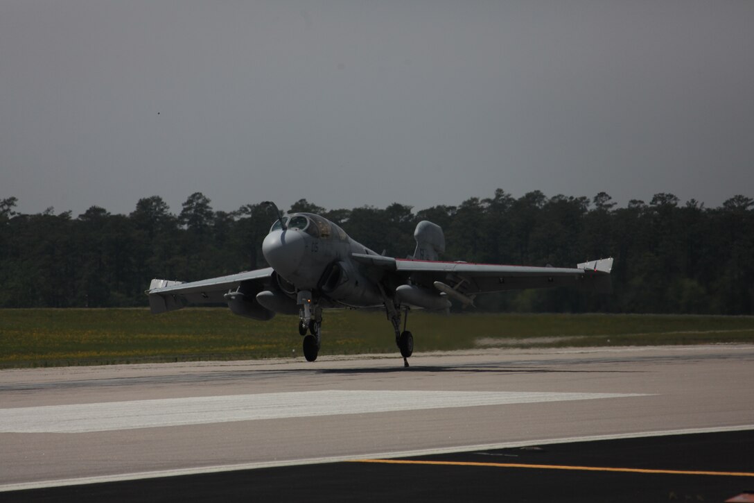 An EA-6B Prowler descends for an arrested landing during a May 4 rehearsal for the Marine Air-Ground Task Force demonstration at Marine Corps Air Station Cherry Point, before the 2012 MCAS Cherry Point “Celebrate the Heritage” Air Show. The E28 Emergency Arresting Gear system is a cable system used to bring fast moving jets to a stop in the event of an emergency landing or need for a short landing space. For Marine Corps Air Station Cherry Point Station Recovery Marines their job and focus is to maintain and operate these systems on the flight line to save the lives of pilots and keep the aircraft safe. If a pilot, whose aircraft has a tail hook, i.e. EA-6B Prowler, needs to make an arrested landing for any emergency, station recovery comes out to the designated flight line gear where they prepare to catch the aircraft. Sgt. Christopher D. Bentley, the maintenance chief for station recovery said the design of these arrest points are to produce the same stopping abilities as the landing cable on an aircraft carrier and the operational procedures of these gears, takes a lot of dedication and time from the Station Recovery Marines. They have to keep these gears well maintained, the gears use an engine to operate, and just like a car, they have a lot of moving parts that need continuous maintenance.