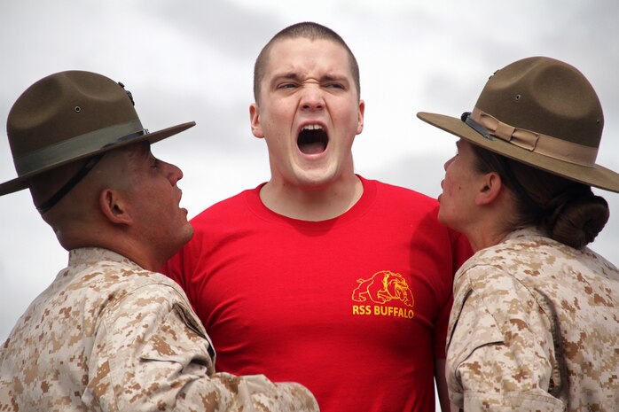 Ryan Gallagher, 20, from Buffalo, Minn., shows drill instructors Staff Sgt. Emmanuel Castillo and Sgt. Jessica Creel just how loud he can get when asked to display his motivation during the 2012 Recruiting Station Twin Cities Mini Boot Camp May 4. Gallagher, who graduated from Buffalo High School in 2010, ships off to boot camp Aug. 12. For additional imagery from the event, visit www.facebook.com/rstwincities.