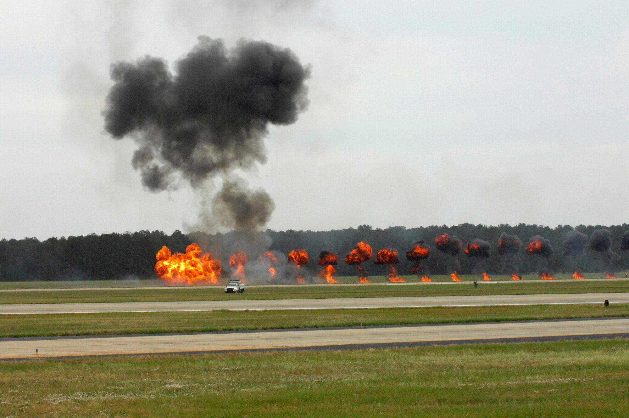 Pyrotechnicians used explosions to simulate munitions being dropped during an air show demonstration on at Shaw Air Force Base, S.C., May 4, 2012. Shaw hosted a Military Appreciation and Special Needs Day to start the Shaw Air Expo. The air show demonstrates the military capabilities of the Air Force  and continues May 5 through 6. (U.S. Air Force photo by Airman 1st Class Krystal M. Jeffers/Released)