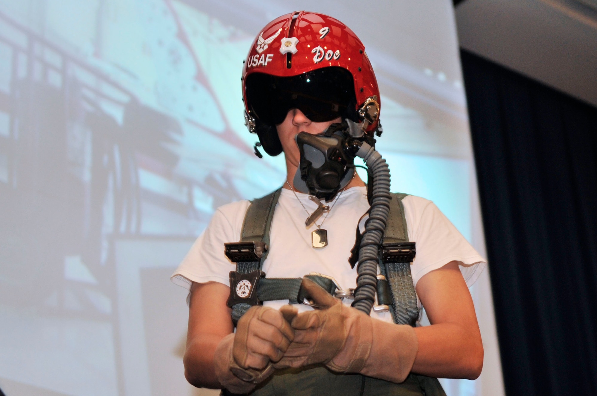 A Sumter High School student tries on a flight suit during a presentation given by the U.S. Air Force Air Demonstration Team "Thunderbirds" at Sumter High School, Sumter, S.C., May 4, 2012.  The Thunderbirds are performing at the Shaw Air Expo May 5 - 6 at Shaw Air Force Base. (U.S. Air Force photo by Airman Nicole Sikorski/Released)