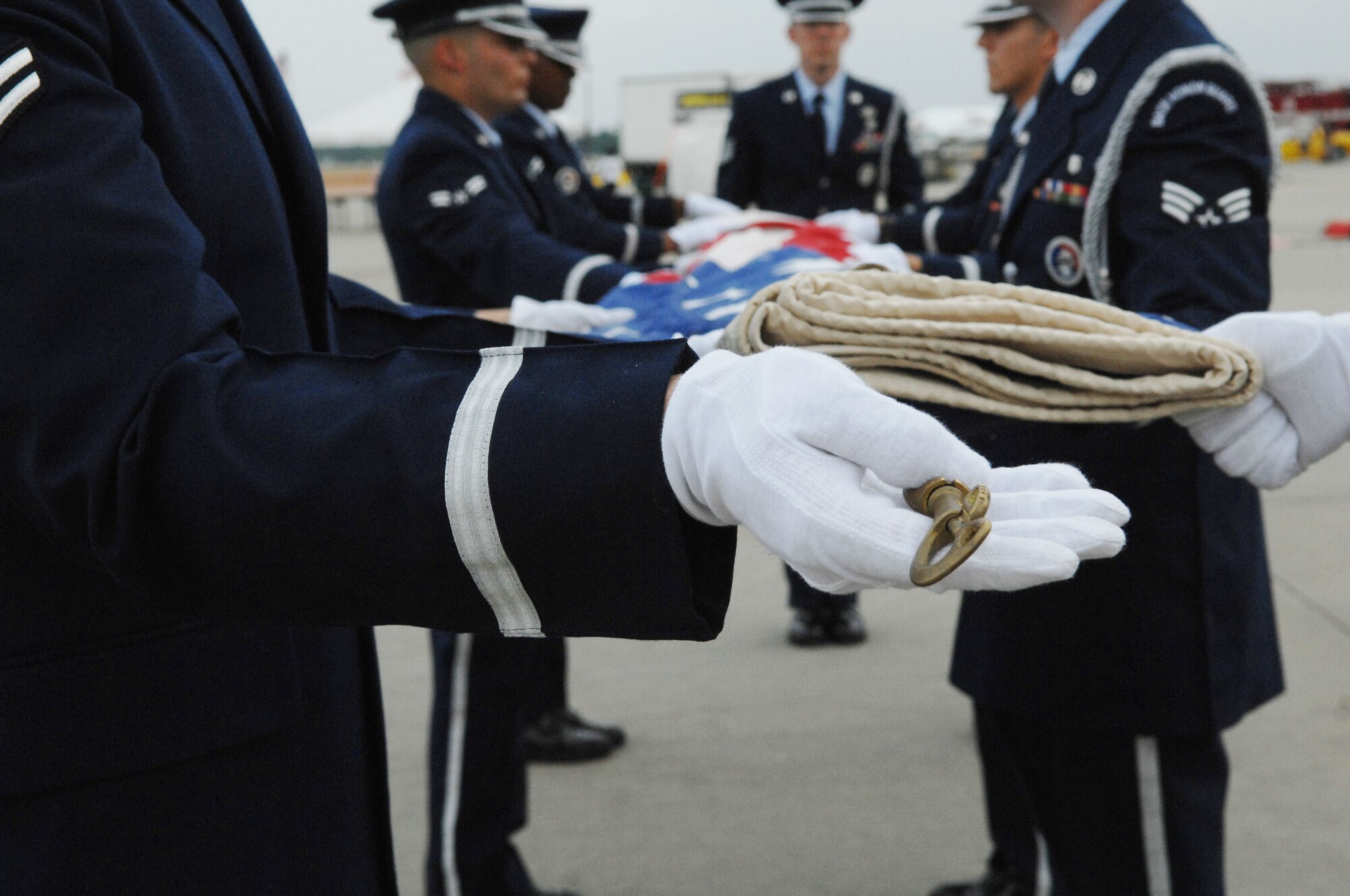 U.S. Air Force Shaw Air Force Base Honor Guard members fold a flag at a retreat ceremony Shaw Air Force Base, S.C., May 4, 2012. The retreat ceremony was in celebration of the Military Appreciation Day during Shaw Air Expo 2012. The Expo continues May 5 and 6.(U.S. Air Force photo by Airman Nicole Sikorski/Released)