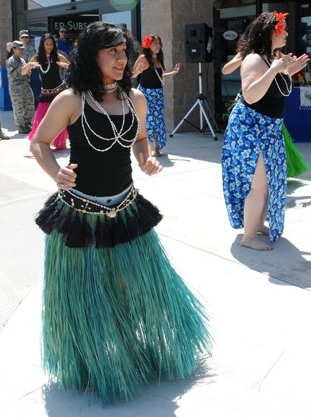 Members of Team Beale’s Tiaré Polynesia dance group perform a hula dance in front of the Base Exchange to kick off Beale’s Asian American/ Pacific Islander Heritage Month at Beale Air Force Base, Calif., May 1, 2012. The dance group will be performing throughout the month’s activities. (U.S. Air Force photo by Senior Airmen Allen Pollard/Released) 