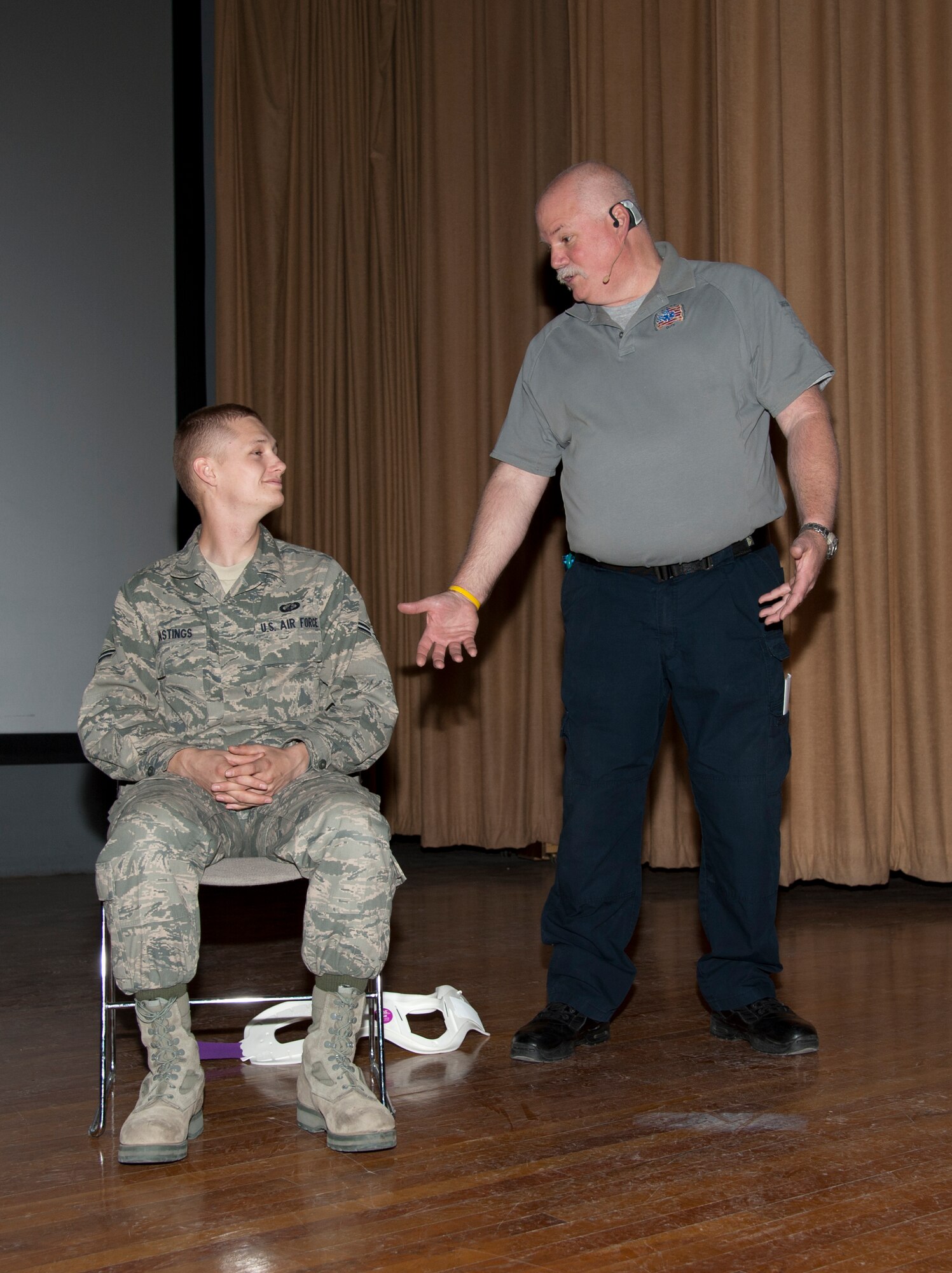 HOLLOMAN AIR FORCE BASE, N.M. - Greg McCarty, a Street Smart presenter, talks to Airmen 1st Class Jesse Hastings, 49th Contracting Squadron contract specialist, about making bad choices behind the wheel during a safety presentation at the base theater here May 2. Street Smart is a program that takes the audience into the real-life drama experienced by firefighters and paramedics as they work to save the lives of individuals who have made poor choices when it comes to drinking, using drugs, and not wearing seat belts. Street Smart coordinated with the 49th Wing Safety office to bring this program here for the first time. (U.S. Air Force photo by Airmen 1st Class Colin Cates/Released)