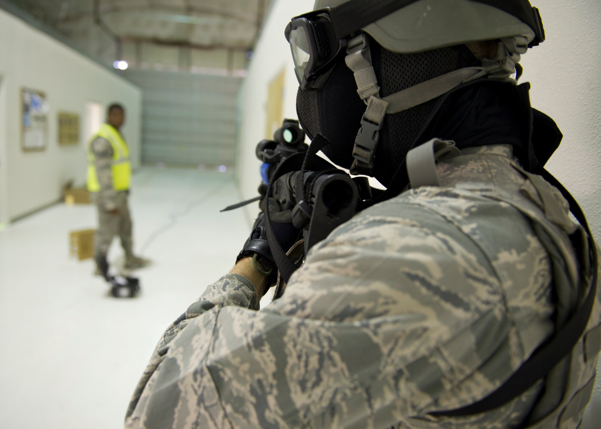 HOLLOMAN AIR FORCE BASE, N.M. – 1st Lt. Justin Dominguez, 49th Security Forces Squadron special reaction team member, guards the hall of a 49th Materiel Maintenance Group facility during a hostage-rescue and barricaded-suspect exercise scenario May 3. During the scenario, the 49th SFS SRT successfully rescued three hostages and neutralized the simulated active gunman without sustaining any simulated injuries or casualties. The team, which is comprised of mainly 49th SFS Airmen, is responsible for responding to any active-shooter, barricaded-suspect, or hostage-rescue scenario that takes place on the installation. (U.S. Air Force photo by Siuta B. Ika/ Released)