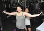 Warhawk Health and Fitness Center exercise physiologist Claudia Holtz helps Staff Sgt. Savannah Kochel, 59th Medical Logistics Readiness Squadron, with an exercise. (U.S. Air Force photo/Alan Boedeker)