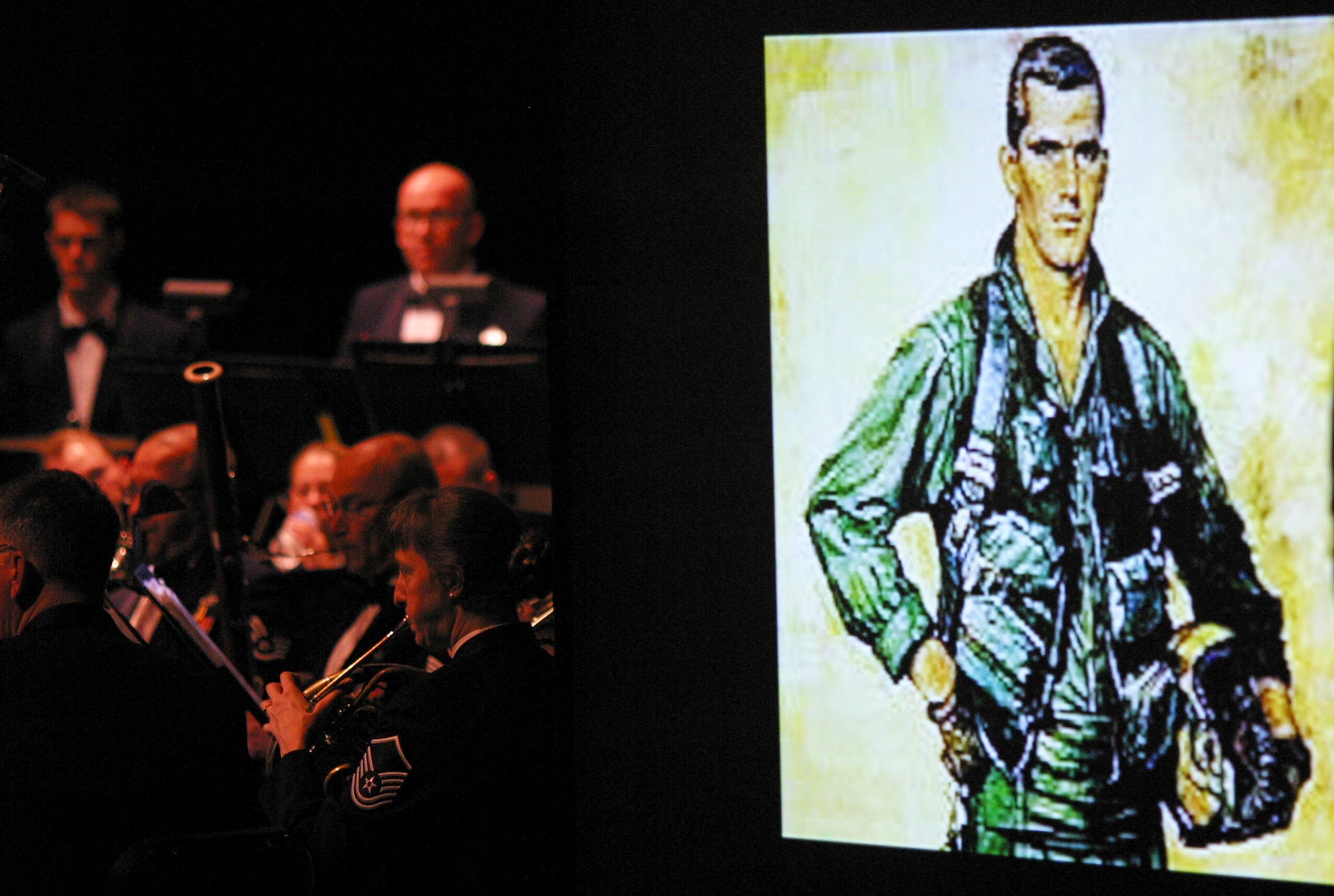 The Band of Mid-America's concert band played a tribute piece dedicated to the late POW, Captain Lance P. Sijan. “A Moment in Air Force Valor”, arranged by the Band of Mid-America’s superintendent, Senior Master Sergeant Dean Smith, is a moving piece which is set to narration. (U.S. Air Force Photo by SrA Carmen Emborski)