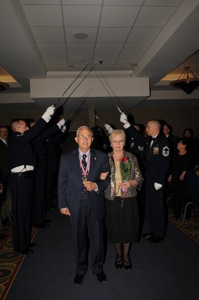 Jim Bradshaw, an honorary ambassador for Grand Forks Air Force Base, N.D., arrives with his wife, Judy, at the Chief’s Recognition Ceremony on April 27, 2012. Bradshaw was named the base’s first-even honorary chief master sergeant during the ceremony. (U.S. Air Force photo by Staff Sgt. Amanda N. Grabiec)