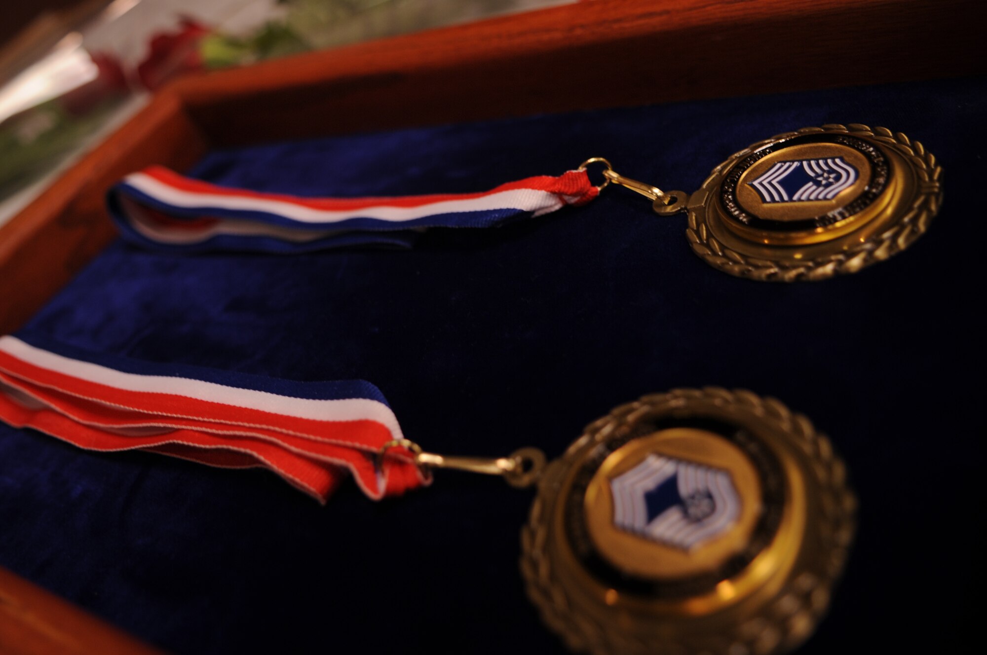 Medallions sit waiting to be placed on Chief Master Sgt. Christopher Crafton and Jim Bradshaw, the newest chief master sergeants at Grand Forks Air Force Base, N.D., during an April 27, 2012, Chief’s Recognition Ceremony.  (U.S. Air Force photo by Staff Sgt. Amanda N. Grabiec)