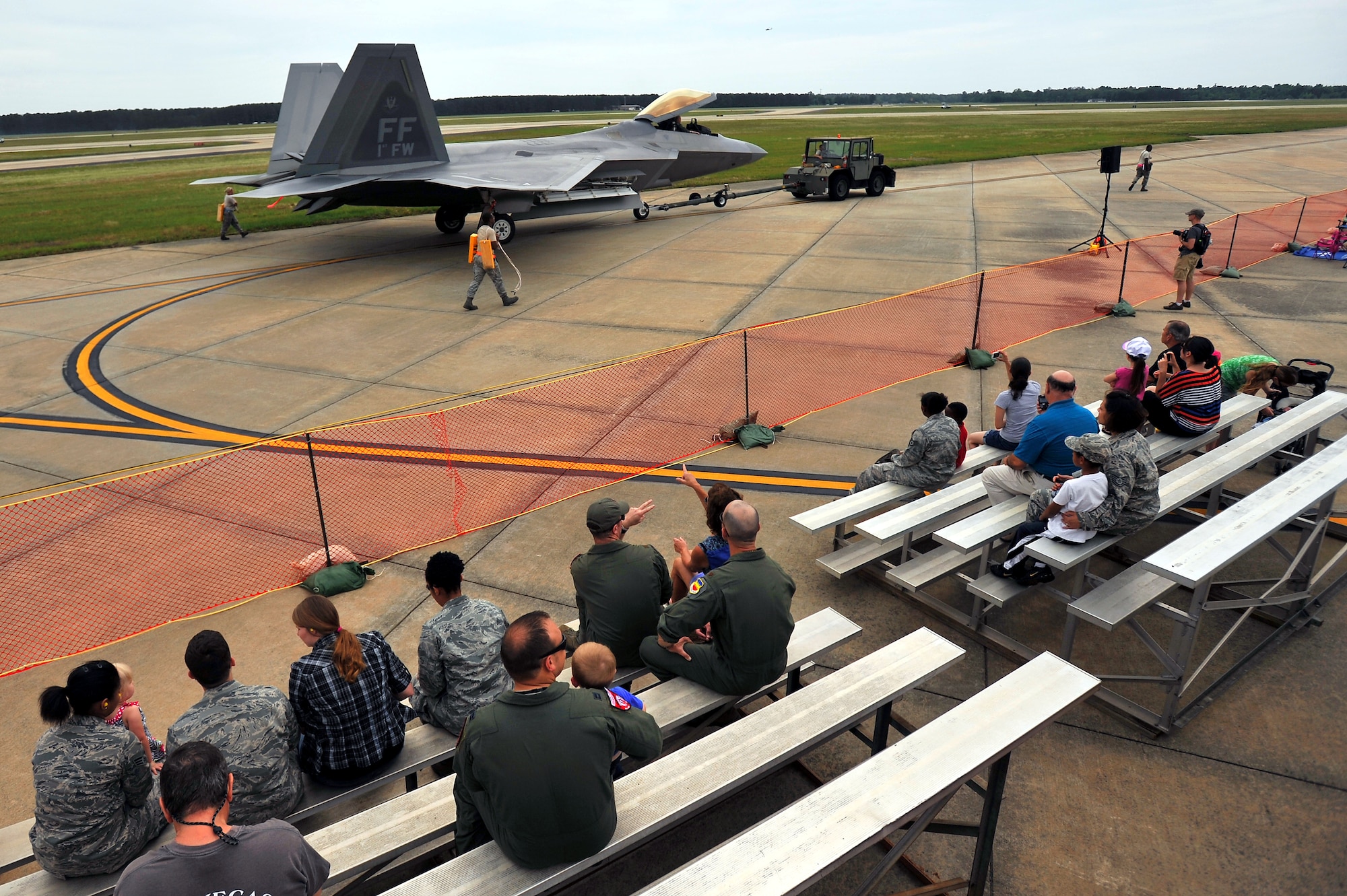 A U.S. Air Force F-22 Raptor is taxied passed the audience in attendance during day one of the Shaw Air Expo, May 4, 2012, Shaw Air Force Base, SC. The Shaw Air Expo kicked off here today giving military members and their families a chance to witness several aircraft performances. Day 2 and 3 of the Air Expo will take place May 5 through 6 and will be open to the public. (U.S. Air Force Photo by Senior Airman Kenny Holston/Released)


