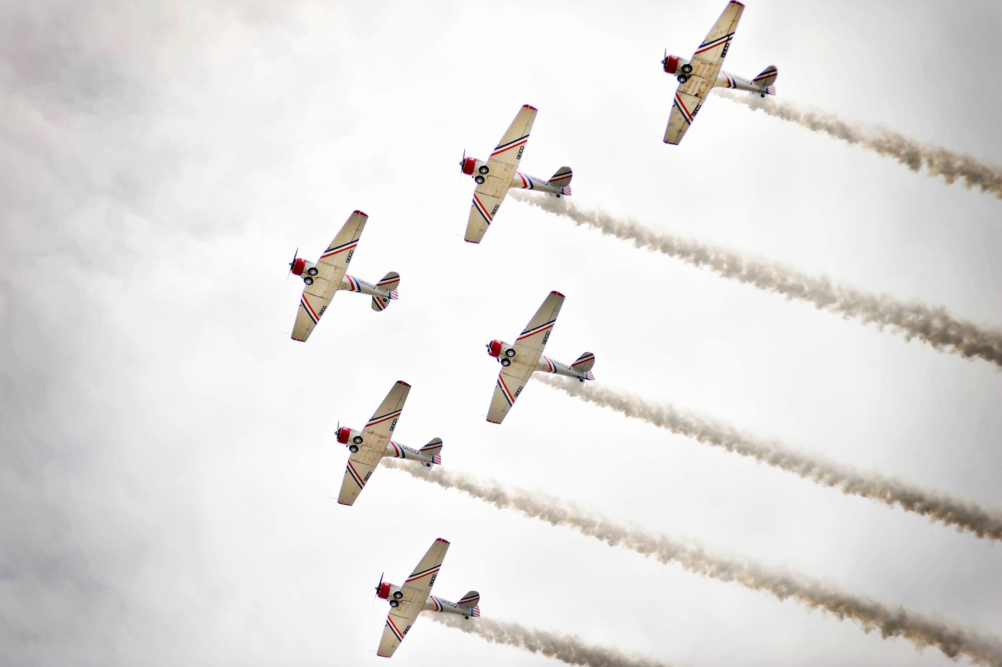 Six SNJ2 Geico Sky Typers fly in formation over the crowd in attendance at day one of the Shaw Air Expo, May 4, 2012, Shaw Air Force Base, SC. The Shaw Air Expo kicked off here today giving military members and their families a chance to witness several aircraft performances. Day 2 and 3 of the Air Expo will take place May 5 through 6 and will be open to the public. (U.S. Air Force Photo by Senior Airman Kenny Holston/Released)


