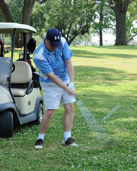 Master Sgt. John Parsons, Air Force Global Strike Command airfield systems maintenance manager, takes his swing during the AFGSC golf tournament on Barksdale Air Force Base, La., May 4. The tournament had 32 participants with prizes awarded to the top three teams. (U.S. Air Force photo/Senior Airman Sean Martin)(RELEASED)