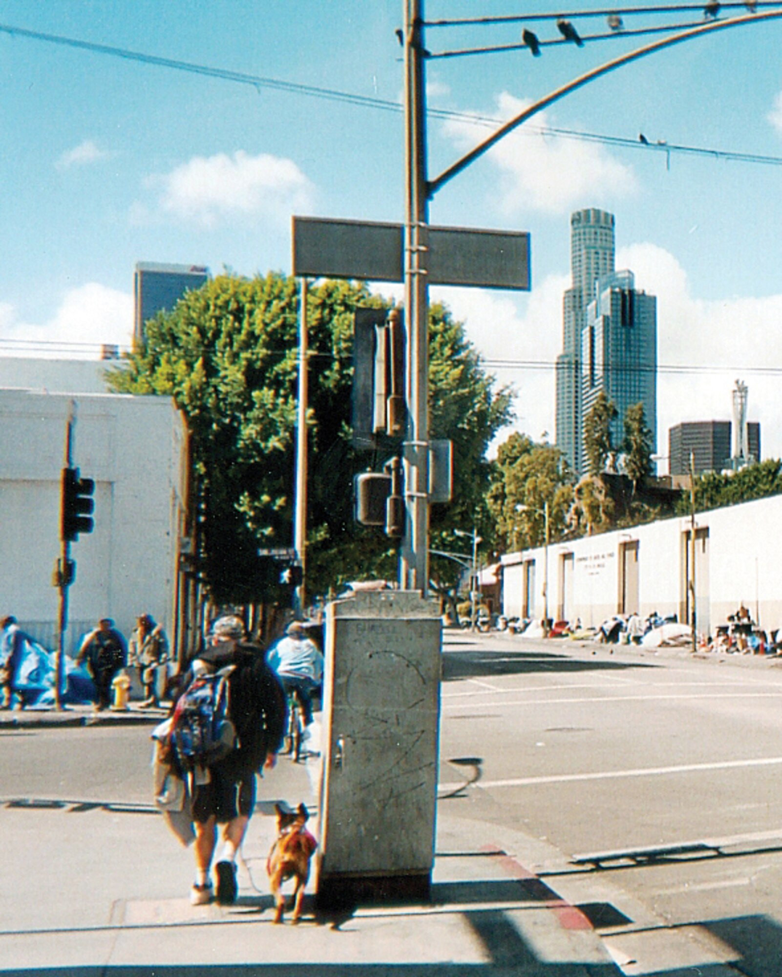 KIRTLAND AFB, N.M. -- Several homeless individuals were at the intersection of Sixth and San Julian Streets in the Skid Row section of Los Angeles in April. Approximately 51,000 individuals are homeless on any given night in the Los Angeles metropolitan area. (Photo by Michael P. Kleiman)