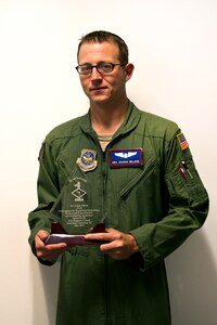 Senior Airman Joshua Nelson poses for a photo with his Diamond Sharp award
at Joint Base Charleston May 2. The Diamond Sharp recipients were Airman 1st Class Jodi Martinez, 1st Combat Camera Squadron, Airman 1st Class Robert Ealey, 437th Aerial Port Squadron, 437th Airlift Wing, and Senior Airman Joshua Nelson, 15th Airlift Squadron, 437th AW. The Diamond Sharp awardees are Airmen chosen by their first sergeants for their excellent performance. (U.S. Air Force photo/Airman 1st Class George Goslin)
