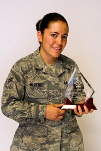 Airman 1st Class Jodi Martinez poses for a photo with her Diamond Sharp
award at Joint Base Charleston May 2. The Diamond Sharp recipients were
Airman 1st Class Jodi Martinez, 1st Combat Camera Squadron, Airman 1st Class
Robert Ealey, 437th Aerial Port Squadron, 437th Airlift Wing, and Senior Airman
Joshua Nelson, 15th Airlift Squadron, 437th AW. The Diamond Sharp
awardees are Airmen chosen by their first sergeants for their excellent
performance. (U.S. Air Force photo/Airman 1st Class George Goslin)
