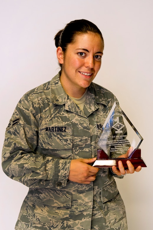 Airman 1st Class Jodi Martinez poses for a photo with her Diamond Sharp
award at Joint Base Charleston May 2. The Diamond Sharp recipients were
Airman 1st Class Jodi Martinez, 1st Combat Camera Squadron, Airman 1st Class
Robert Ealey, 437th Aerial Port Squadron, 437th Airlift Wing, and Senior Airman
Joshua Nelson, 15th Airlift Squadron, 437th AW. The Diamond Sharp
awardees are Airmen chosen by their first sergeants for their excellent
performance. (U.S. Air Force photo/Airman 1st Class George Goslin)
