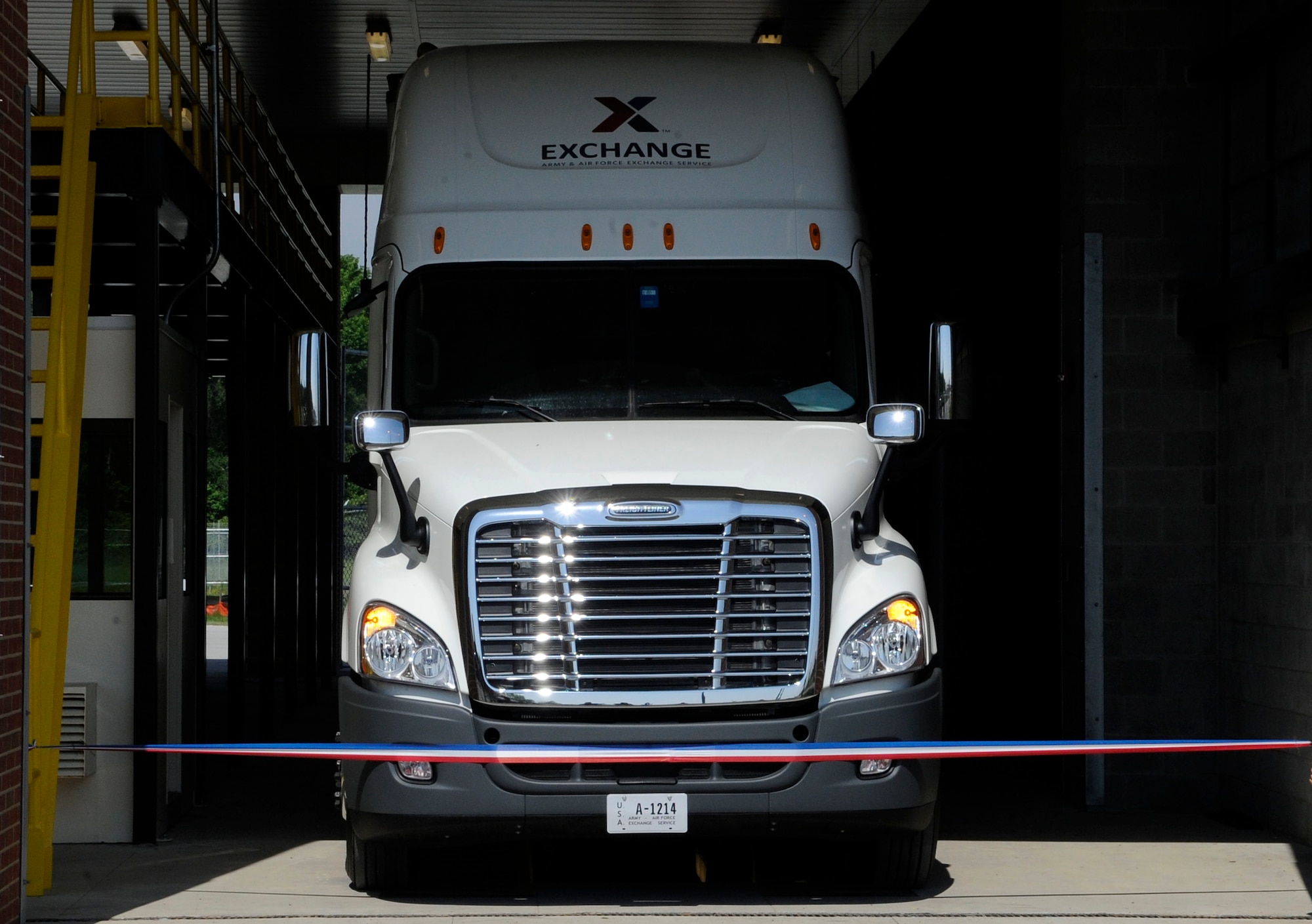 An Army-Air Force Exchange Services truck prepares to break the ribbon during the ribbon cutting ceremony for the Large Vehicle Inspection Station at Langley Air Force Base, Va., May 4, 2012. The newly designed LVIS was built to enhance the base?s capability to inspect vehicles and ensure greater force protection measures for the base resources and personnel. (U.S. Air Force photo by Staff Sgt. Dana Hill/Released)