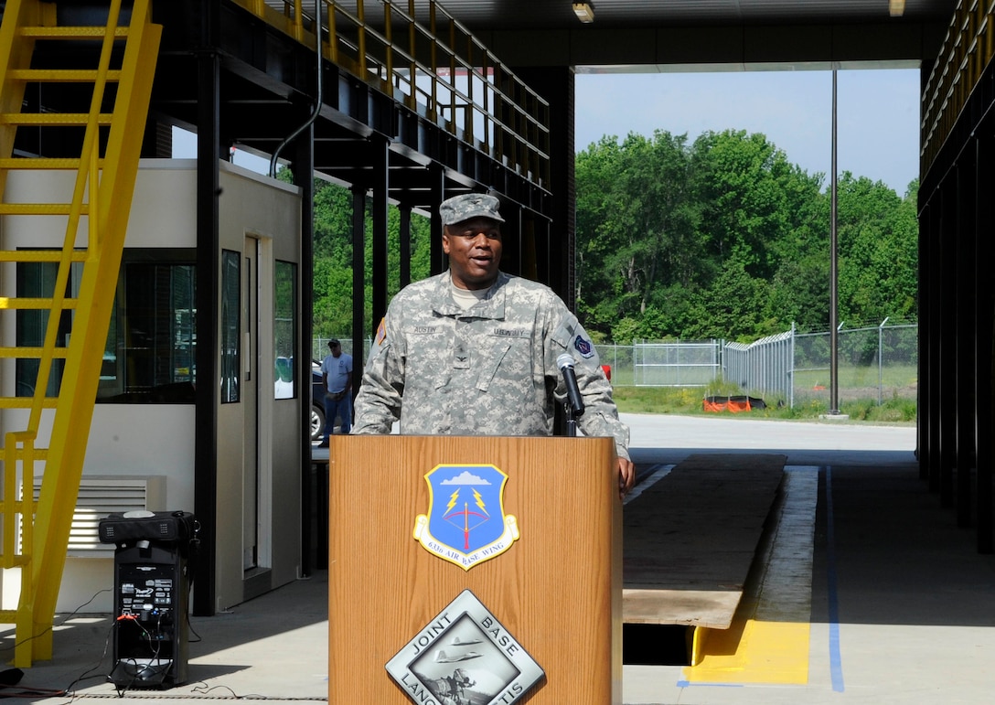 U.S. Army Col Reggie Austin, 633d Air Base Wing vice commander, addresses the crowd during the ribbon cutting ceremony for the Large Vehicle Inspection Station at Langley Air Force Base, Va., May 4, 2012. The LVIS at the West gate is part of a $7.2 million, two-phase project geared toward enhancing security measures on base.  (U.S. Air Force photo by Staff Sgt. Dana Hill/Released)