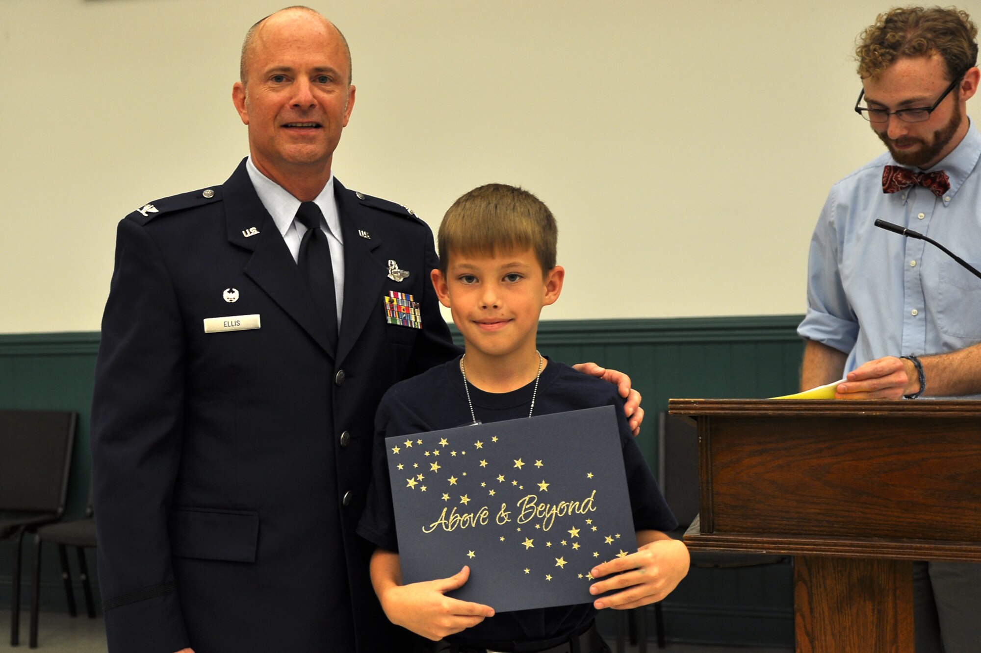 Col. Jon Ellis, commander of the 307th Bomb Wing, Barksdale Air Force Base, La., poses with Dylan Tietje, a 5th grade student at St. Joseph Catholic School in Shreveport, La., May 3, 2012. Dylan received the “Shining Star Award” for his outstanding performance while attending STARBASE.  Students completed an exciting 25-hour hands on/minds on aviation and aerospace course offered to area 5th graders and their teachers by STARBASE Louisiana, at Barksdale. The program is one of 60 national STARBASE sites, and is sponsored by the 307 BW of the Air Force Reserve Command. Many U.S. Air Force servicemembers volunteer to speak at the graduation ceremonies to help motivate the students to continue their education. This was Ellis’ first time as a guest speaker for a STARBASE graduation ceremony. Speakers are always welcomed and always needed. Any officer or senior noncommissioned officer interested in motivating these young people should contact the 307th Bomb Wing Public Affairs Office at 318-529-3023 to be put on the speaker’s list. (U.S. Air Force photo by Betty Stephens)