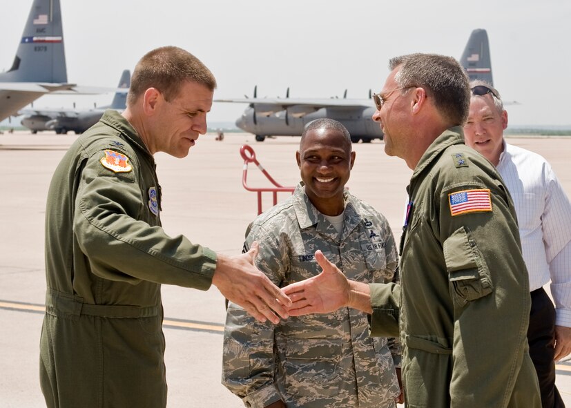 U.S. Air Force Col. Walter Ward, left, 317th Airlift Group commander, meets with U.S. Air Force Maj. Gen. Scott Hanson, Carl A. Spaatz Center of Officer Education commander, after the delivery of Dyess’ 19th C-130J Super Hercules May 3, 2012, at Dyess Air Force Base, Texas.  This is Dyess’ 19th of 28 C-130J Super Hercules to be delivered, replacing the current legacy fleet. (U.S. Air Force Photo by Airman 1st Class Peter Thompson/ Released)