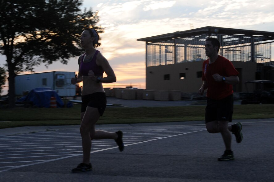 Airmen participate in a Fitness Month 20K run at Moody Air Force Base, Ga., May 4, 2012. The run had approximately 45 runners and trophies were given for first, second, and third place finishers. (U.S. Air Force photo by Staff Sgt. Ciara Wymbs/Released)  