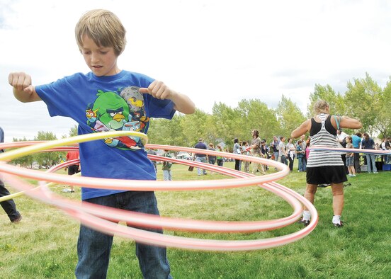 KIRTLAND AFB, N.M. -- Nine-year-old Cody Shell shows off his hula hoop skills during the Earth Day event April 26 that featured an element of physical fitness and health awareness. (Photo by Todd Berenger)
