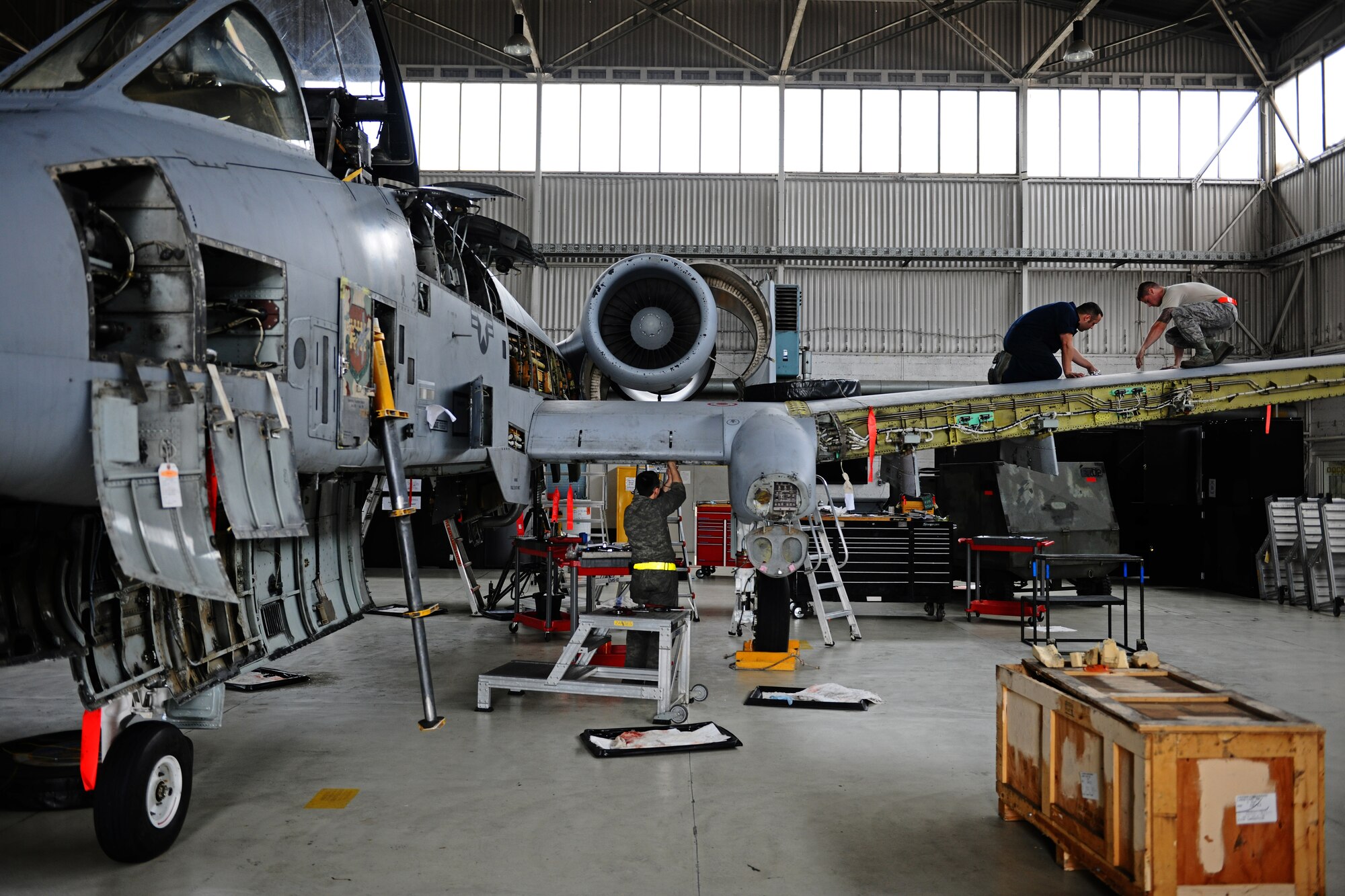 SPANGDAHLEM AIR BASE, Germany – Airman from the 52nd Equipment Maintenance Squadron Maintenance Flight conduct a phase inspection on an A-10 Thunderbolt II in Hangar 2 here May 4. The phase inspections are separated into two categories. During a phase 1 inspection, the 52nd EMS Maintenance Flight members examine each A-10 after every 500 flying hours, and phase 2 inspections are performed every 1,000 flying hours. These inspections allow the Airmen to check for deficiencies and perform preventative maintenance to ensure the aircraft is safe and operational for flight. (U.S. Air Force photo by Airman 1st Class Matthew B. Fredericks/Released)