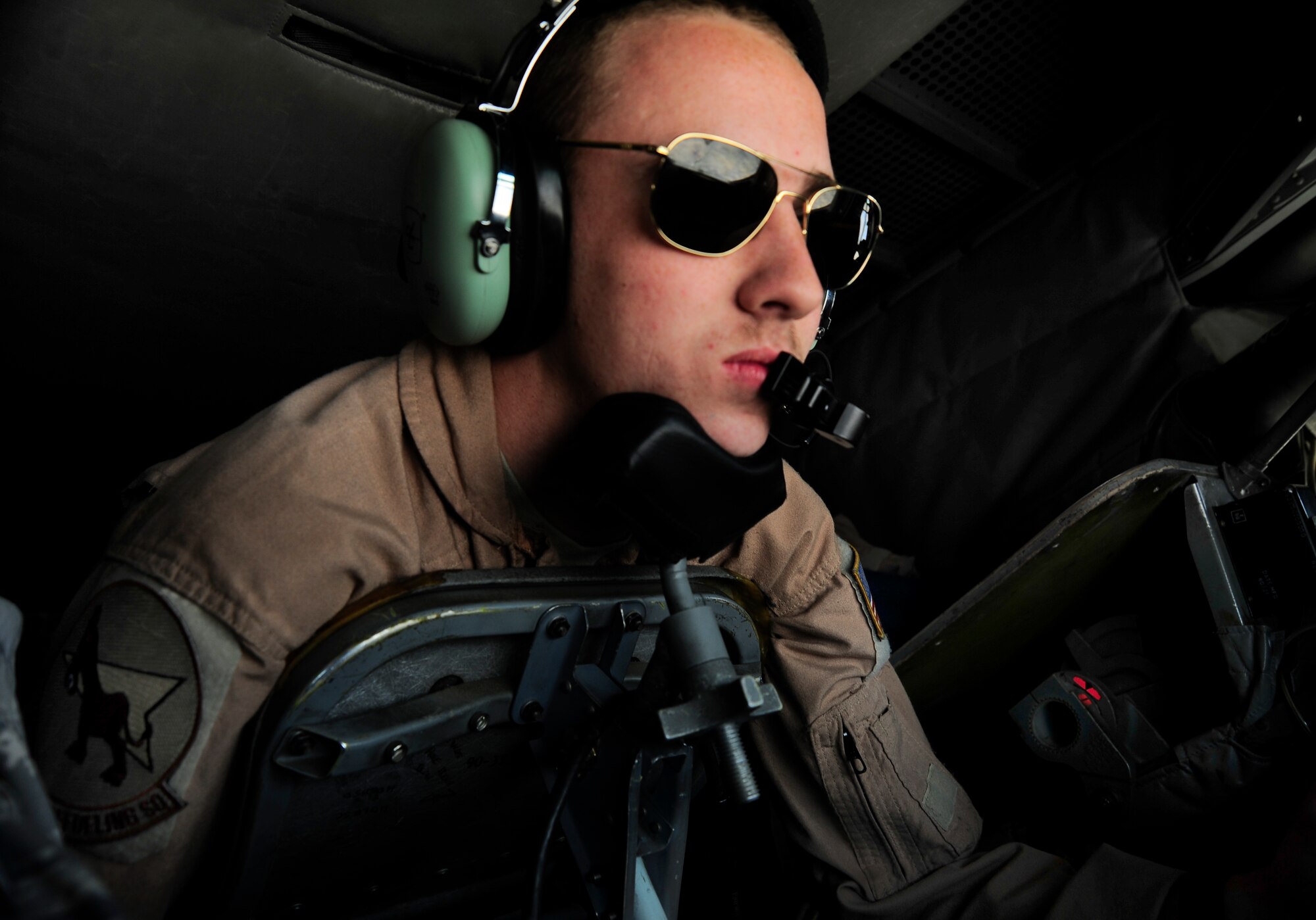 Senior Airman Cameron Bilyeu operates the boom on a KC-135 Stratotanker May 4, 2012, during the aerial refueling of an F-16 Fighting Falcon over Afghanistan. The KC-135 delivered more than 33,000 pounds of fuel to five aircraft on this mission. Bilyeu is a 22nd Expeditionary Air Refueling Squadron KC-135 boom operator deployed to the Transit Center at Manas, Kyrgyzstan, from Fairchild Air Force Base, Wash. (U.S. Air Force photo/Staff Sgt. Angela Ruiz)
