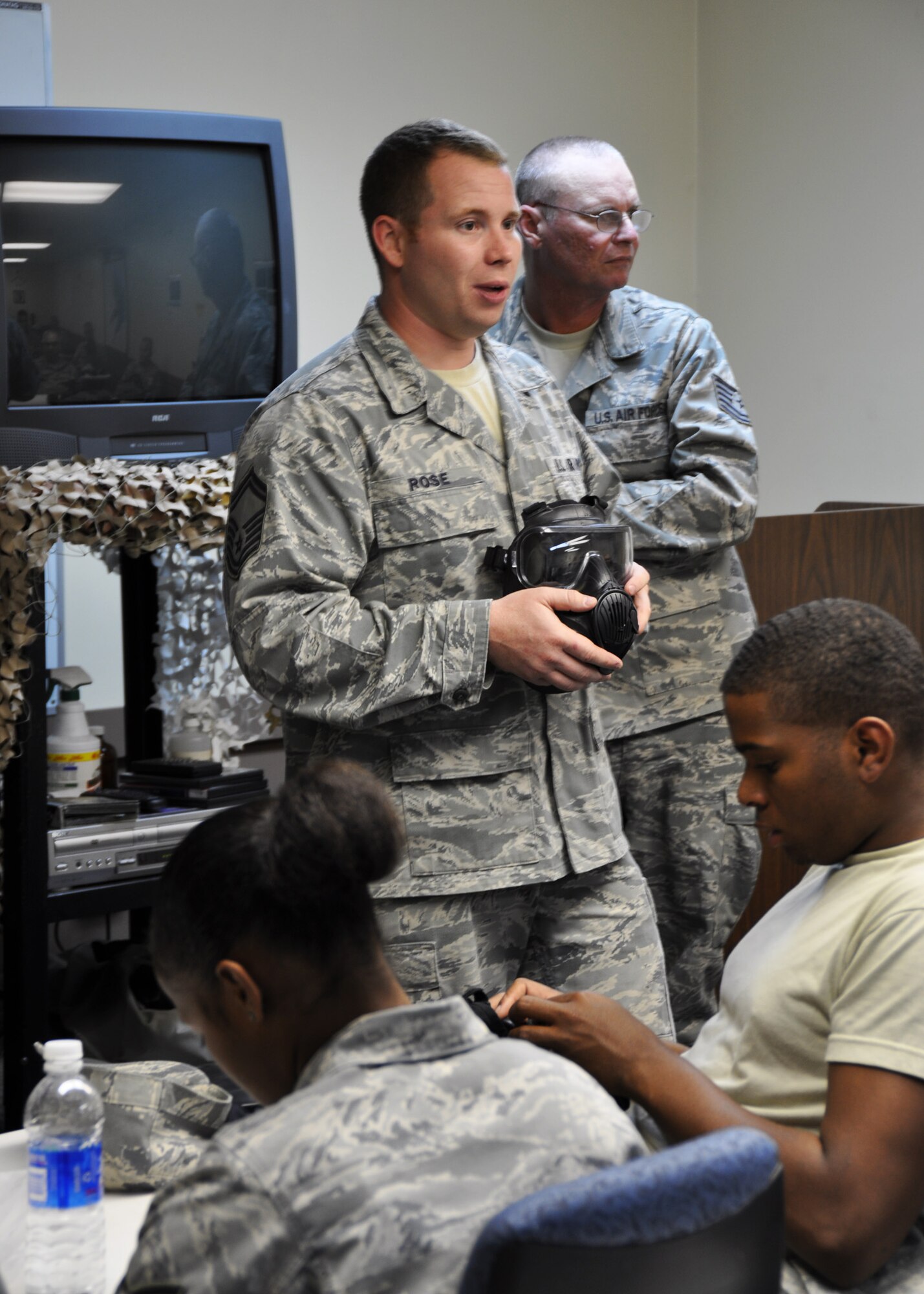 Senior Master Sgt. Jeffrey Rose, 919th Civil Engineering Squadron, conducts a gas mask refresher training class at Duke Field April 13.  The course was one of more than a dozen mass training events held during the 919th Special Operations Wing's annual four-day Super Unit Training Assembly.  (U.S. Air Force photo/Dan Neely)