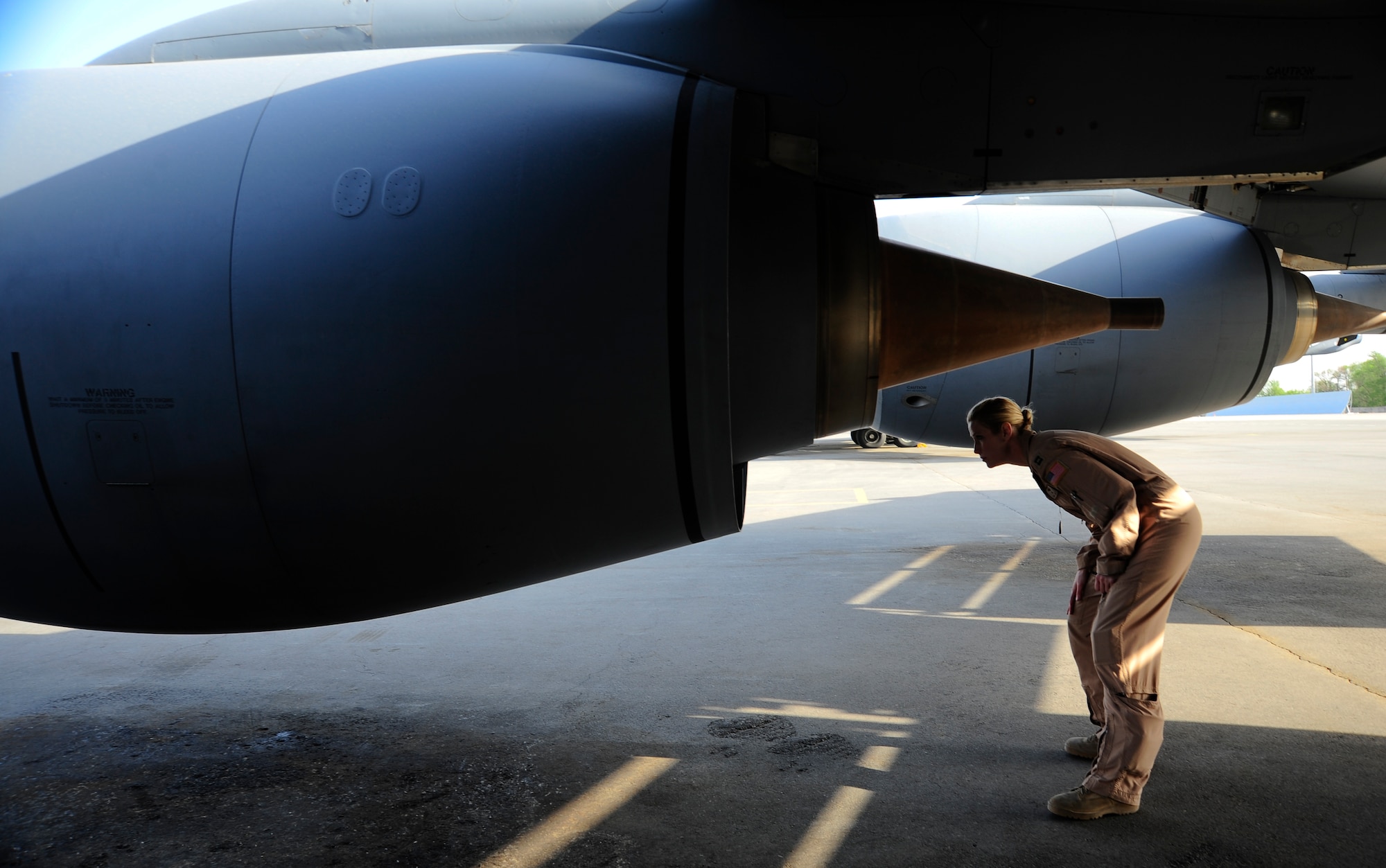 Capt. Tanya Dubiel conducts pre-flight checks on a KC-135 Stratotanker May 4, 2012, at the Transit Center at Manas, Kyrgyzstan before taking off on the 22nd Expeditonary Air Refueling Squadron's 25,000th mission. Dubiel is a 22nd EAS KC-135 pilot deployed to the Transit Center at Manas, Kyrgyzstan, from Fairchild Air Force Base, Wash. (U.S. Air Force photo/Staff Sgt. Angela Ruiz)