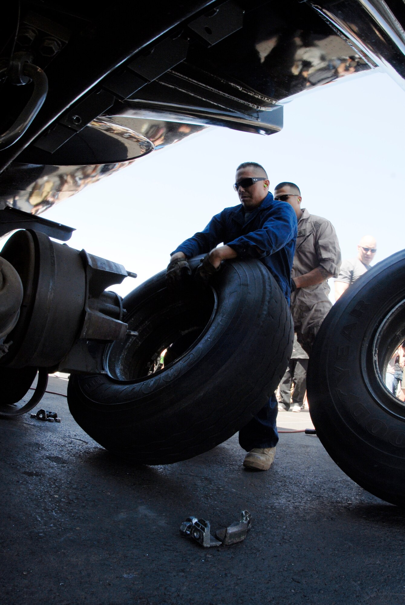 Staff Sgt. Michael Aragon, 56th Logistics Readiness Squadron fuels specialist, prepares to lift a tire to place it back on the vehicle during the tire change event of the Petroleum, Oil and Lubricants Roadeo Saturday at the Luke Air Force Base POL compound. During the tire changing event each team had to remove a set of dual tires from a vehicle, push one around a track and put the tires back on the vehicle in the other’s place. The team completed the tire change in 1:47.87.  (U.S. Air Force photo by Airman 1st Class David Owsianka)