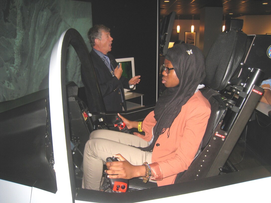Mariam Cocker, from Eleanor Roosvelt High School in Maryland, takes the controls of an F-35 Simulator, during the a “Fighter Pilot for a Day” program at Joint Base Andrews, Md., April 20. Cocker was there as an essay winner of the Air Force 2020 STEM challenge, supporting careers in science, technology, engineering and math. (Courtesy photo)