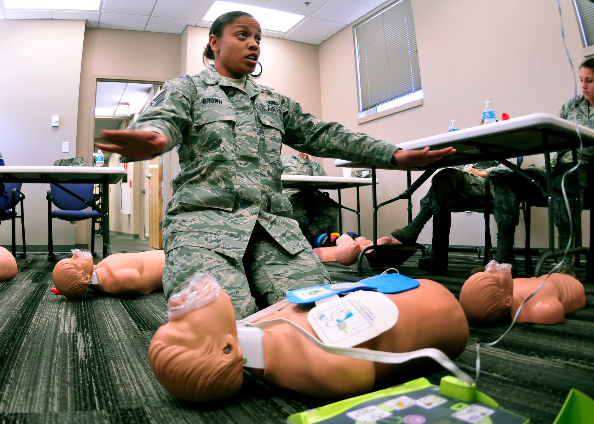 Staff Sgt. Samantha Brown, 919th Operations Support Squadron, discusses rescue breathing procedures she will be using on a mannequin during training to receive her cardiopulmonary resuscitation certificate at Duke Field April 13.  The course was one of more than a dozen mass training events held during the 919th Special Operations Wing's annual four-day Super Unit Training Assembly.  (U.S. Air Force photo/Tech. Sgt. Cheryl Foster)