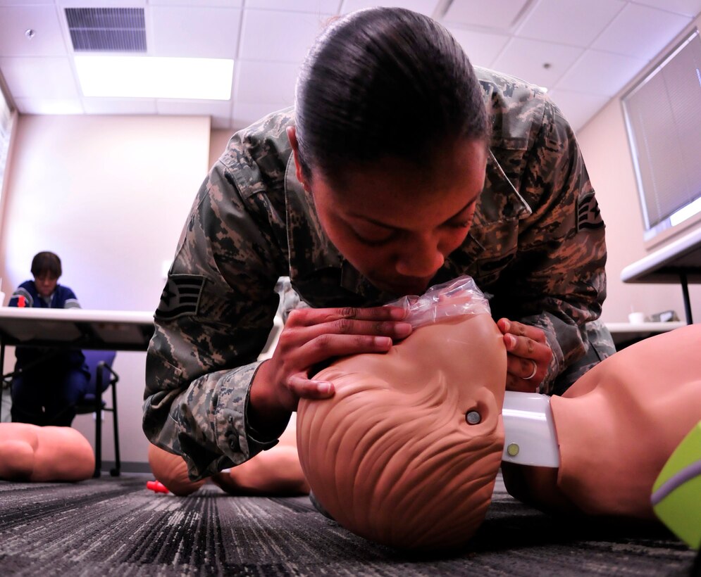 Staff Sgt. Samantha Brown, 919th Operations Support Squadron, demonstrates rescue breathing on a mannequin during training to receive her cardiopulmonary resuscitation certificate at Duke Field April 13.  The course was one of more than a dozen mass training events held during the 919th Special Operations Wing's annual four-day Super Unit Training Assembly.  (U.S. Air Force photo/Tech. Sgt. Cheryl Foster)