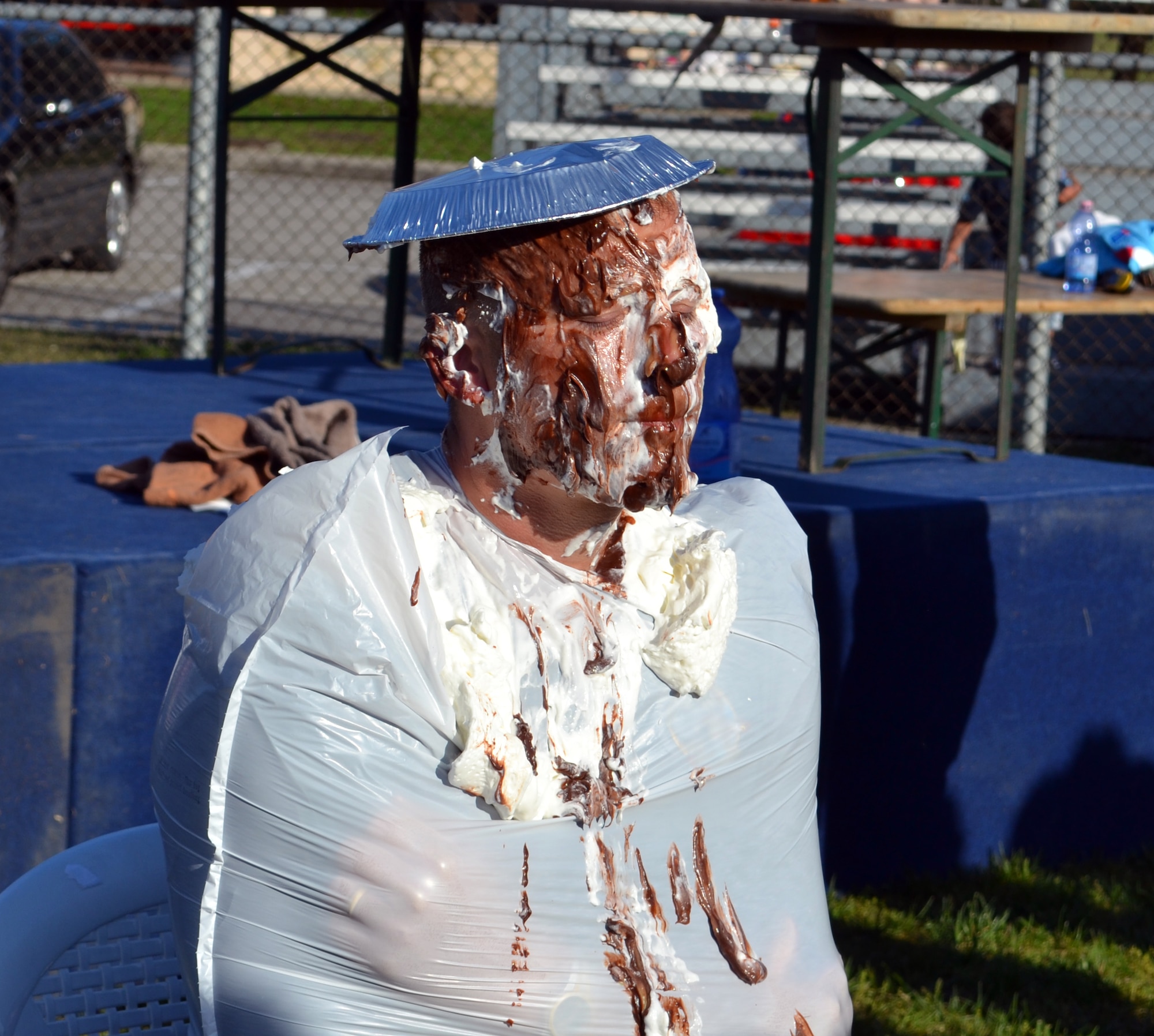 Senior Master Sgt. Thomas Bathe, 31st Civil Engineer Squadron operations flight superintendent, gets a pie thrown in his face during a Relay for Life event, raising 60 euro  for the American Cancer Society April 28 at Aviano Air Base Italy. Aviano’s 2012 Relay For Life 12-hour event had 16 booths selling food, beverages and more, raising $14,194.17 for the American Cancer Society . (U.S. Air Force photo/Senior Airman Amber Swearengin)