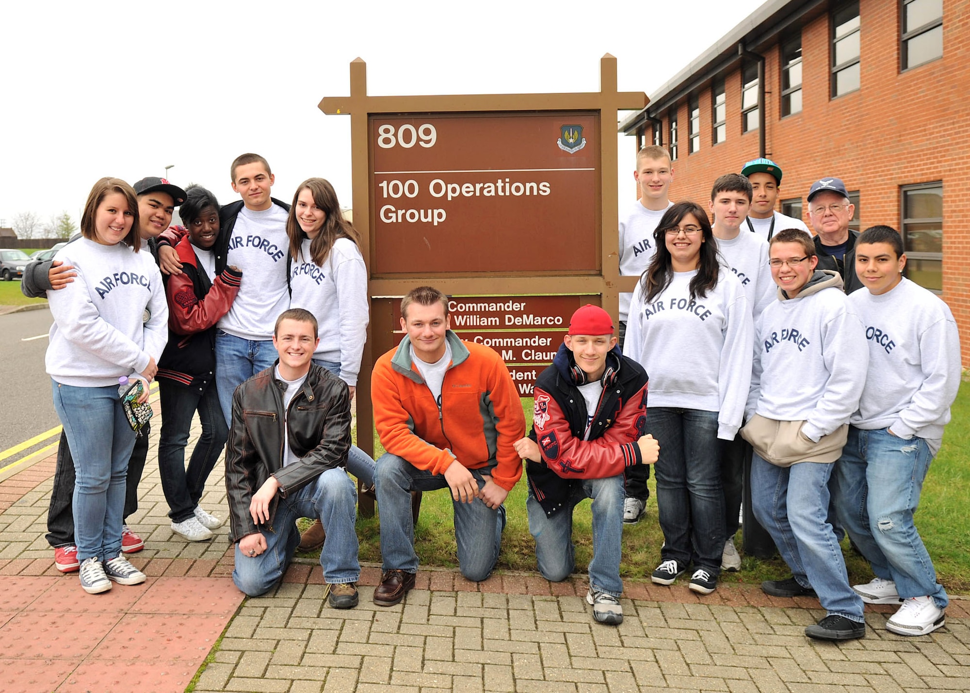 RAF MILDENHALL, England – Cadets from the RAF Lakenheath High School Air Force Junior Reserve Officer Training Corps program pose for a group photo outside the 100th Operations Group here May 3, 2012. Fourteen top-performing cadets from the AF JROTC program were awarded a behind-the-scenes look into AF operations and flying missions. (U.S. Air Force photo/Senior Airman Jerilyn Quintanilla)