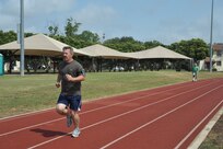 Rich Kay takes a few minutes out of his day to go for a run Tuesday at the Joint Base San Antonio-Randolph outdoor track. (U.S. Air Force photo by Airman 1st Class Lincoln Korver) 