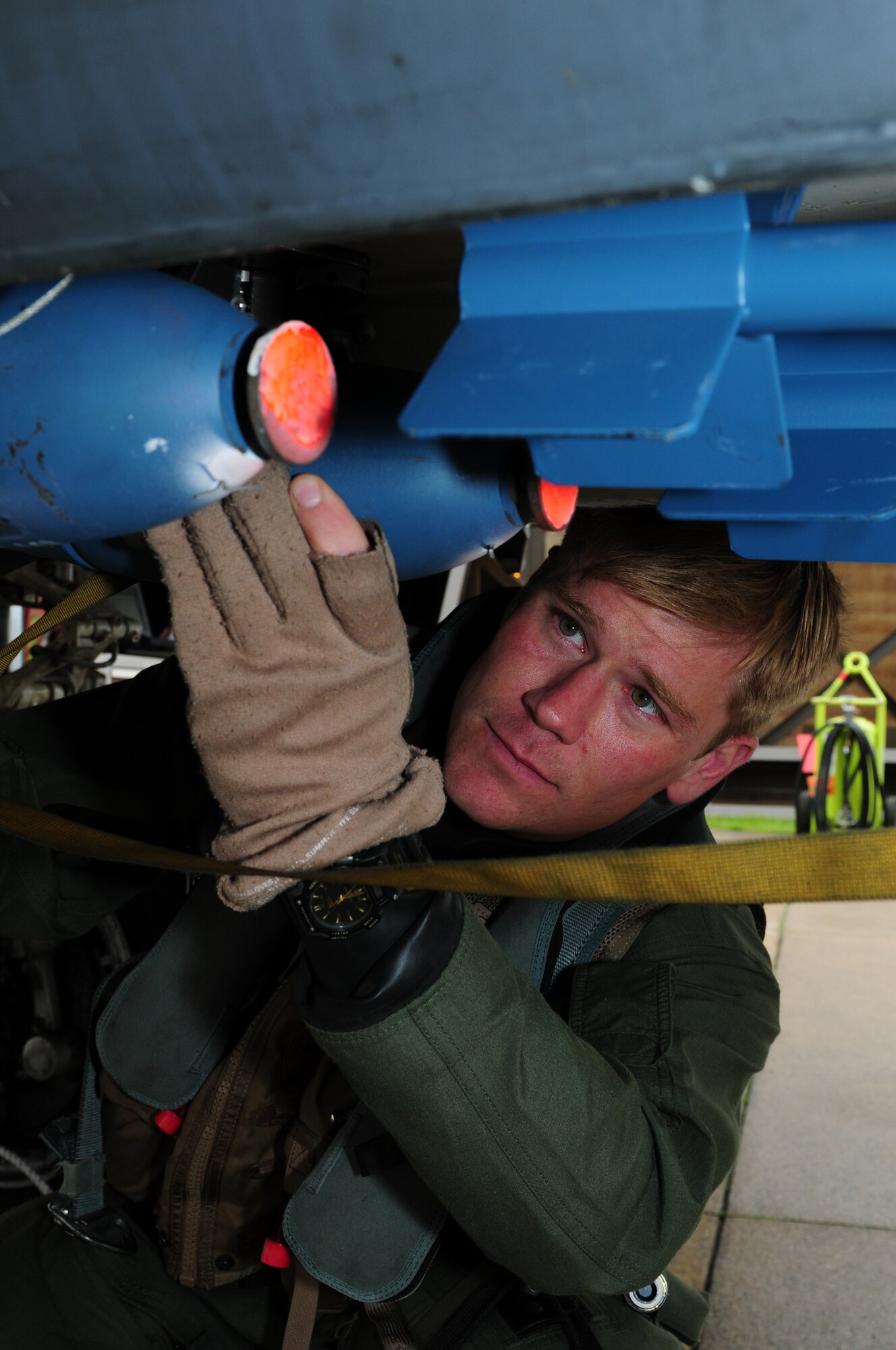 ROYAL AIR FORCE LAKENHEATH, England – Capt. Jeremiah Carlson, 494th Fighter Squadron weapons system officer, checks a BDU-33 practice munition during pre-flight checks May 3, 2012. Carlson made the U.S. Air Force Rugby Team after trying out and winning the 34th Annual St. Patrick’s Day Rugby tournament held in Savannah, Ga.  (U.S. Air Force photo by Airman 1st Class Cory D. Payne)