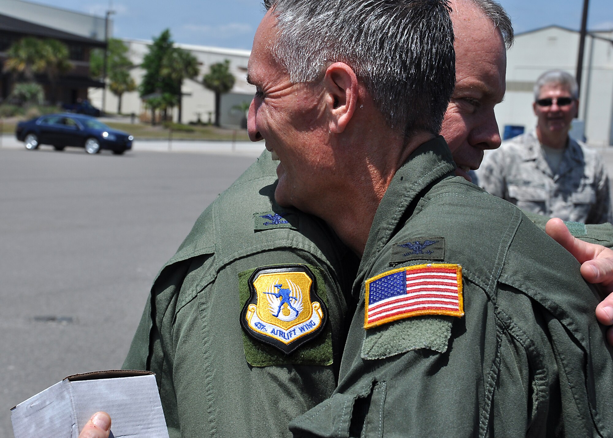 Col. Erik Hansen, 437th Airlift Wing commander, congratulates Col. Steven Chapman, 315th Airlift Wing commander, after the Reserve commander landed his "fini flight" in a Charleston C-17 Globemaster III May 3, 2012 at Joint Base Charleston, S.C. (U.S. Air Force photo by Michael Dukes)