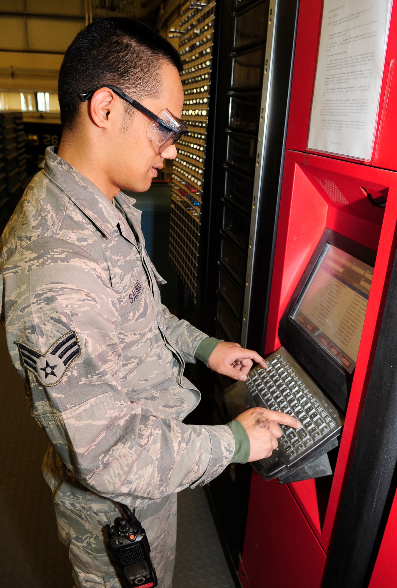 RAF MILDENHALL, England – Senior Airman Vincent Salinas, 100th Maintenance Squadron Aircraft Structural Maintenance journeyman, types in the code number of a replacement nut plate into a Robo Crib here May 3, 2012. The Robo Crib tracks, dispenses and monitors the quantity of all hardware for the aircraft structural maintenance flight. (U.S. Air Force photo/Senior Airman Ethan Morgan)