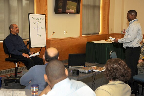 Lt. Gen. (ret.) Daniel James III, former director of the National Guard Bureau, listens to a question from Capt. Donald Davenport during a Leadership Challenge Program at Selfridge Air National Guard Base, Mich., May 2, 2012. James offered some of his ideas on what makes a strong leader and team member during the training. Davenport is a pilot with the 171st Air Refueling Squadron. Students in the training class wore civilian attire. (U.S. Air Force photo by John S. Swanson)