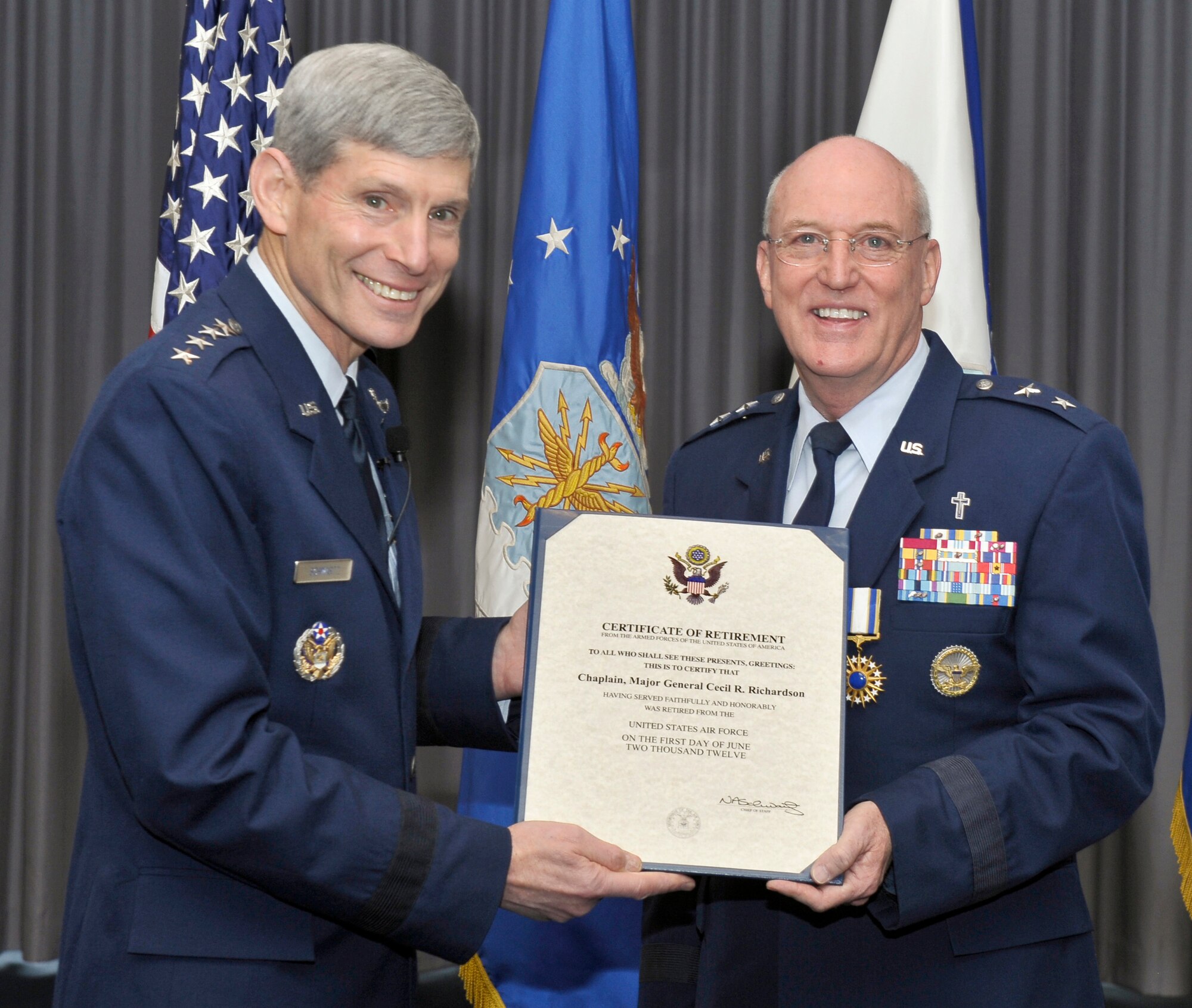 Air Force Chief of Staff Gen. Norton Schwartz congratulates Maj. Gen. Cecil Richardson during his retirement ceremony April 30, 2012, at Joint Base Anacostia-Bolling, D.C.  Richardson was the Air Force Chief of Chaplains at the time of his retirement.  (U.S. Air Force photo/Michael J. Pausic)