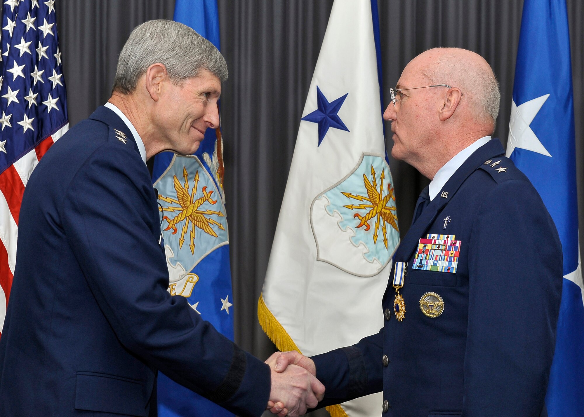Air Force Chief of Staff Gen. Norton Schwartz congratulates Maj. Gen. Cecil Richardson during his retirement ceremony April 30, 2012, at Joint Base Anacostia-Bolling, D.C.  Richardson was the Air Force Chief of Chaplains at the time of his retirement.  (U.S. Air Force photo/Michael J. Pausic)